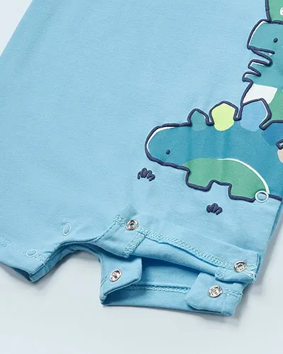 Pagliaccetto azzurro a mezza manica con stampa dinosauri in verde e azzurro laterale 2-6 mesi